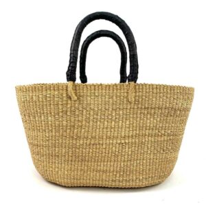a woven brighton basket win natural straw colour with black leather handles