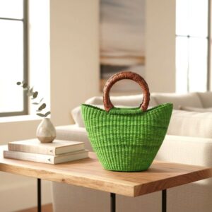 African bolga mini market basket in green on a wooden coffee table in a living room