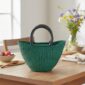 African bolga small market basket in turquoise on a dining table