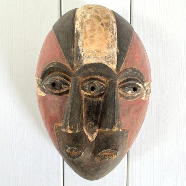 traditional nigerian ogoni mask in earthy painted colours
