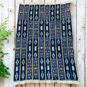 Traditional plant-dyed cloth with textured variations.