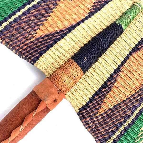 bashiri-fan-s1-262-fanny-bolga-hand-fan-woven-2 Close-up of the weave and leather handle on the green and purple Bolga fan