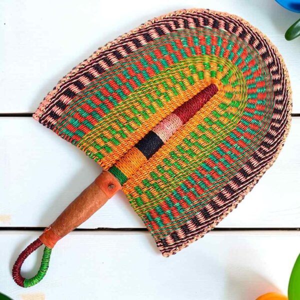 Woven Bolga hand fan in orange and green with a leather-wrapped handle