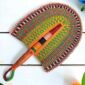 Woven Bolga hand fan in orange and green with a leather-wrapped handle