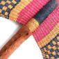 Close-up of the weave and leather handle on the pink and black Bolga fan
