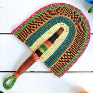 Woven Bolga hand fan in teal and pink with a leather-wrapped handle