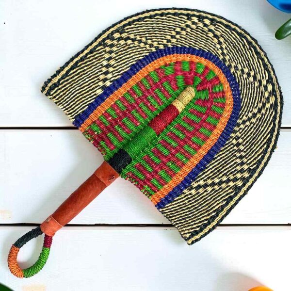 Woven Bolga hand fan in blue, green and black with a leather-wrapped handle