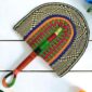 Woven Bolga hand fan in blue, green and black with a leather-wrapped handle