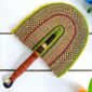 Woven Bolga hand fan in natural and yellow with a leather-wrapped handle