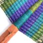 Close-up of the weave and leather handle on the blue and purple Bolga fan
