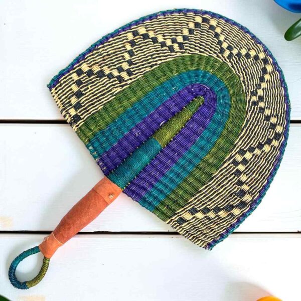 Woven Bolga hand fan in blue and purple with a leather-wrapped handle