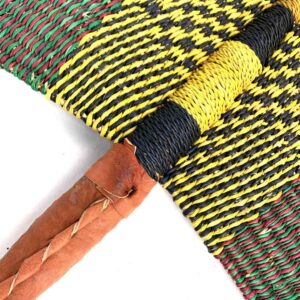 Close-up of the weave and leather handle on the yellow and black Bolga fan
