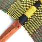 Close-up of the weave and leather handle on the yellow and black Bolga fan