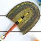 Woven Bolga hand fan in yellow and black with a leather-wrapped handle