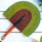 Woven Bolga hand fan in lime and brown with a leather-wrapped handle