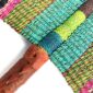 Close-up of the weave and leather handle on the pink, olive and teal Bolga fan