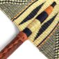 Close-up of the weave and leather handle on the black and natural Bolga fan