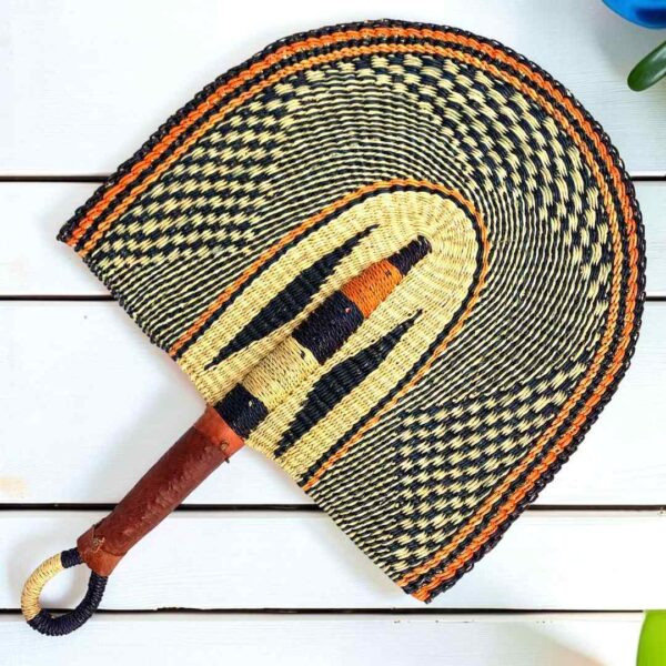 Woven Bolga hand fan in black and natural with a leather-wrapped handle