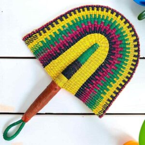 Woven Bolga hand fan in yellow and green with a leather-wrapped handle