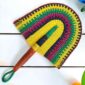 Woven Bolga hand fan in yellow and green with a leather-wrapped handle
