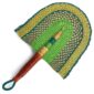 Full view of the green and teal woven Bolga fan on a white background
