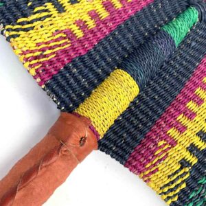 Close-up of the weave and leather handle on the navy and yellow Bolga fan