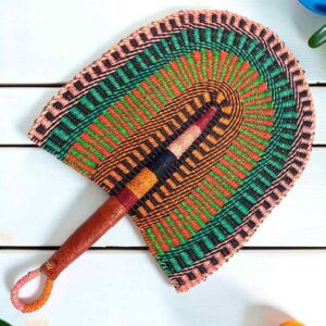 Woven Bolga hand fan in green and orange with a leather-wrapped handle