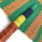 Close-up of the weave and leather handle on the purple and green Bolga fan