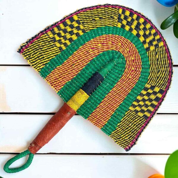 Woven Bolga hand fan in purple and green with a leather-wrapped handle