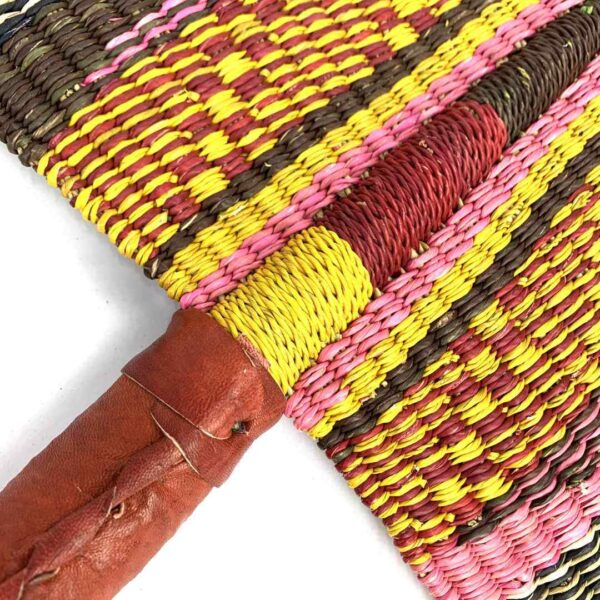 bashiri-fan-s1-284-wave-woven-fan-handmade-2 Close-up of the weave and leather handle on the pink and orange Bolga fan