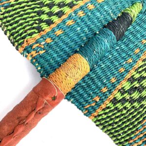 bashiri-fan-s1-285-ohmy-bolga-fan-elephant-grass-2 Close-up of the weave and leather handle on the lime and teal Bolga fan