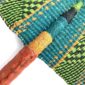 Close-up of the weave and leather handle on the lime and teal Bolga fan