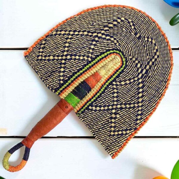 Woven Bolga hand fan in black and orange with a leather-wrapped handle