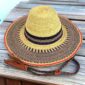 Wide brim Bolga hat with a natural crown and navy and natural band