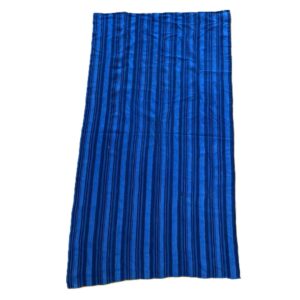 bashiri-indigo-cotton-228-tamale-handwoven-african-fabric-2 Full view of the indigo cotton cloth in mid and deep blue stripes on a white background