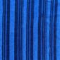 Close-up of the indigo cotton cloth in mid and deep blue stripes