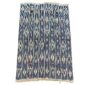 Full view of the indigo cotton cloth with columns of pale diamond motifs on a white background