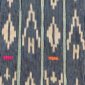 Close-up of the indigo cotton cloth with columns of pale diamond motifs