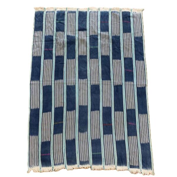 bashiri-indigo-cotton-230-wa-african-cotton-fabric-woven-2 Full view of the indigo cotton cloth with solid and pinstriped panels on a white background