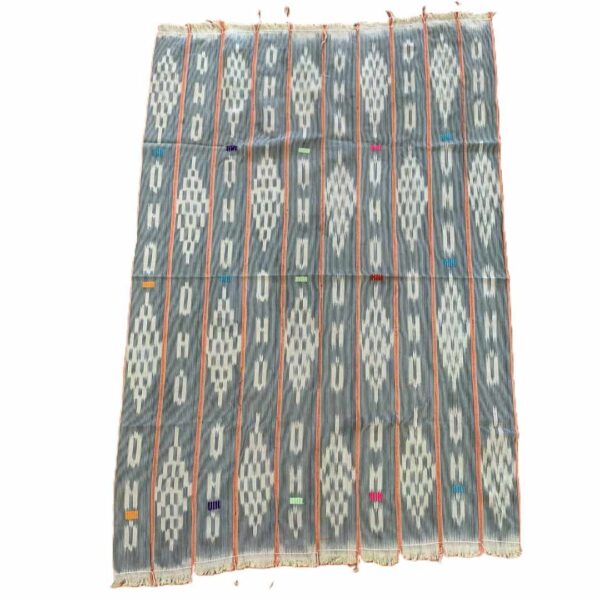 bashiri-indigo-cotton-232-salaga-handwoven-african-fabric-2 Full view of the faded indigo cotton cloth with pale diamond lattice motifs on a white background