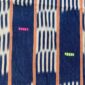 Close-up of the deep indigo cotton cloth with pale striped bands