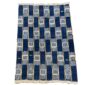Full view of the indigo cotton cloth in a checkerboard of deep and pale blocks on a white background