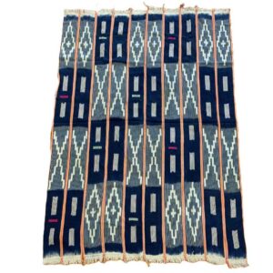 bashiri-indigo-cotton-236-larabanga-handwoven-african-fabric-2 Full view of the dark indigo cotton cloth with pale zigzag and window motifs on a white background