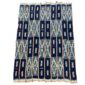 Full view of the dark indigo cotton cloth with pale zigzag and window motifs on a white background