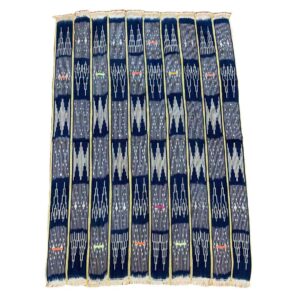 bashiri-indigo-cotton-238-volta-african-cotton-fabric-woven-2 Full view of the dark indigo cotton cloth with pale arrow and zigzag motifs on a white background