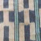 Close-up of the pale cotton cloth with a stepped pattern of indigo blocks