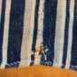 Close-up of the cotton cloth with fine indigo and pale stripes