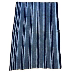 bashiri-indigo-cotton-244-akosombo-african-textile-handwoven-2 Full view of the grey-blue cotton cloth with bands of dark and pale stripes on a white background