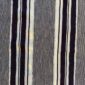 Close-up of the grey-blue cotton cloth with bands of dark and pale stripes