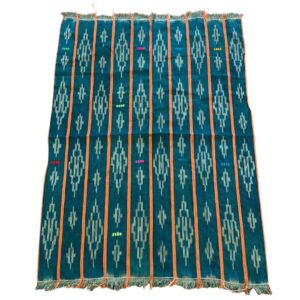 bashiri-indigo-cotton-245-damongo-african-cotton-fabric-woven-2 Full view of the green-blue cotton cloth with pale diamond motifs on a white background